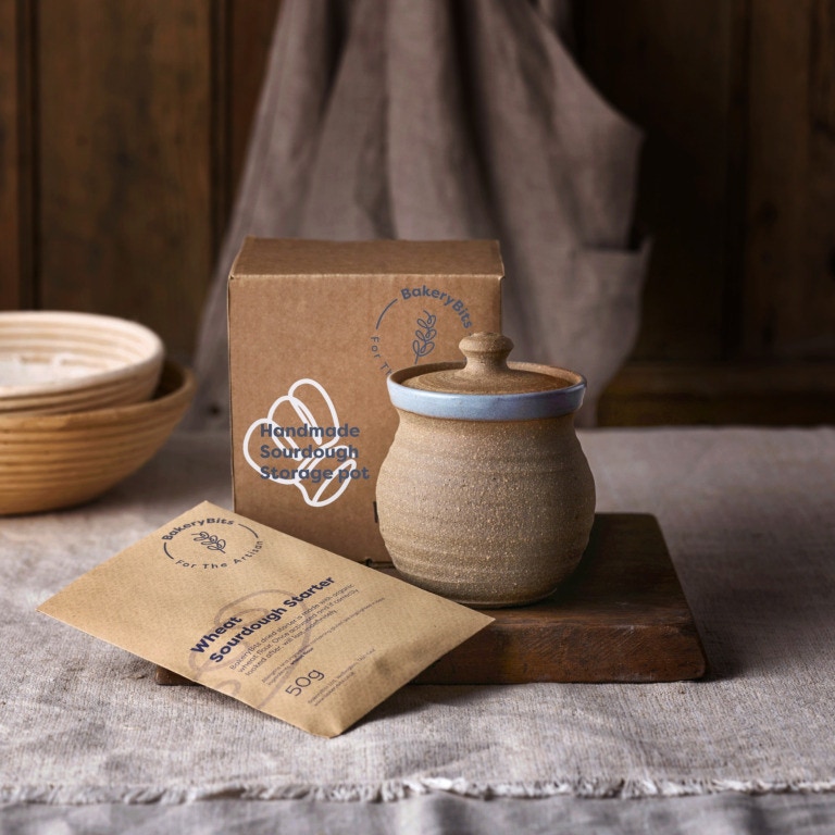 Hand-thrown ceramic pot for holding sourdough starter with a sachet of dried starter and a bespoke gift box.